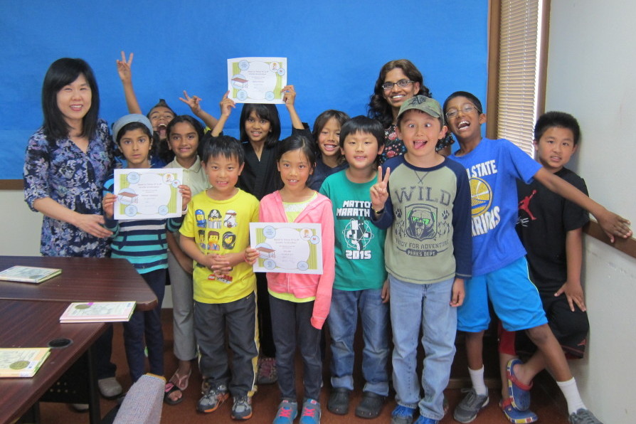 Read to Thrive volunteer reading with students